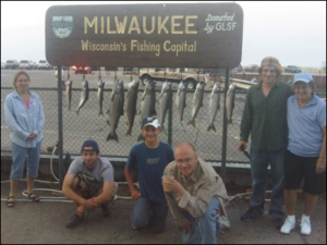 group of 6 standing in front of their fish
