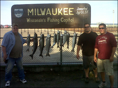 group of 3 with the fish they caught