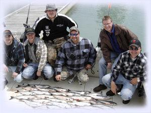 Charter fishing group with their buckets of fish